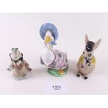 A Wade novelty Miss Kathy figure, a Wade rabbit and a Beatrix Potter figure a/f