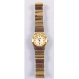 An 18 carat gold and stainless steel Omega Constellation ladies wrist watch, recently serviced and