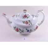 An early 19th century porcelain teapot painted floral sprigs