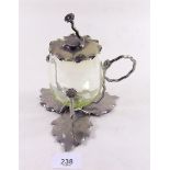 A silver plated Art Nouveau preserve pot with green glass body
