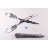 A pair of 19th century silver handled scissors in silver sheath