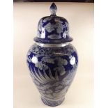 A large blue and white Chinese stoneware reproduction vase and cover - 56cm