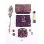A brass seed head and leaf form paperknife, an early plastic cased travel manicure set and three