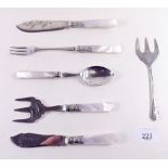 A group of silver plated and mother of pearl cutlery including cake forks, pickle fork, butter knife