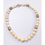 A coloured large freshwater pearl necklace with 18 carat gold white clasp