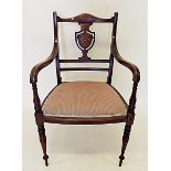 An Edwardian shield back carver chair with marquetry decoration