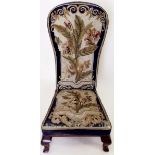 A Victorian pine dieu chair with original floral tapestry and blue velvet upholstery