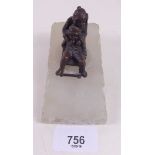 A small bronze finish group of children on a sled mounted on alabaster slope base, 12cm long