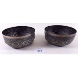 A pair of Indian white metal bowls with embossed decoration 8.7 ozs