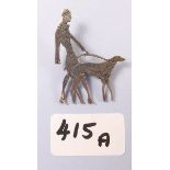 A sterling silver Art Deco style brooch with woman and afghan hound