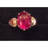 A 9 carat gold ring set oval cut spinel