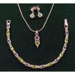 A silver demi parure bracelet, earrings and necklace set with peridot and amethyst