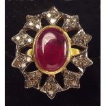 A large ruby and diamond open cluster ring