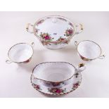 A Royal Albert Country Roses dinner service comprising: six dinner plates, two tureens, meat