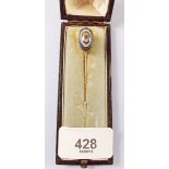 A Victorian yellow metal mounted beaded agate stick pin dated and inscribed 1879, cased