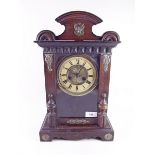 A mahogany finish shelf clock