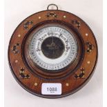 An Edwardian inlaid mahogany circular barometer