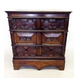 A late 17th century oak chest of three fielded and panelled drawers all raised on replacement low