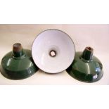 A set of three green enameled industrial lamp shades