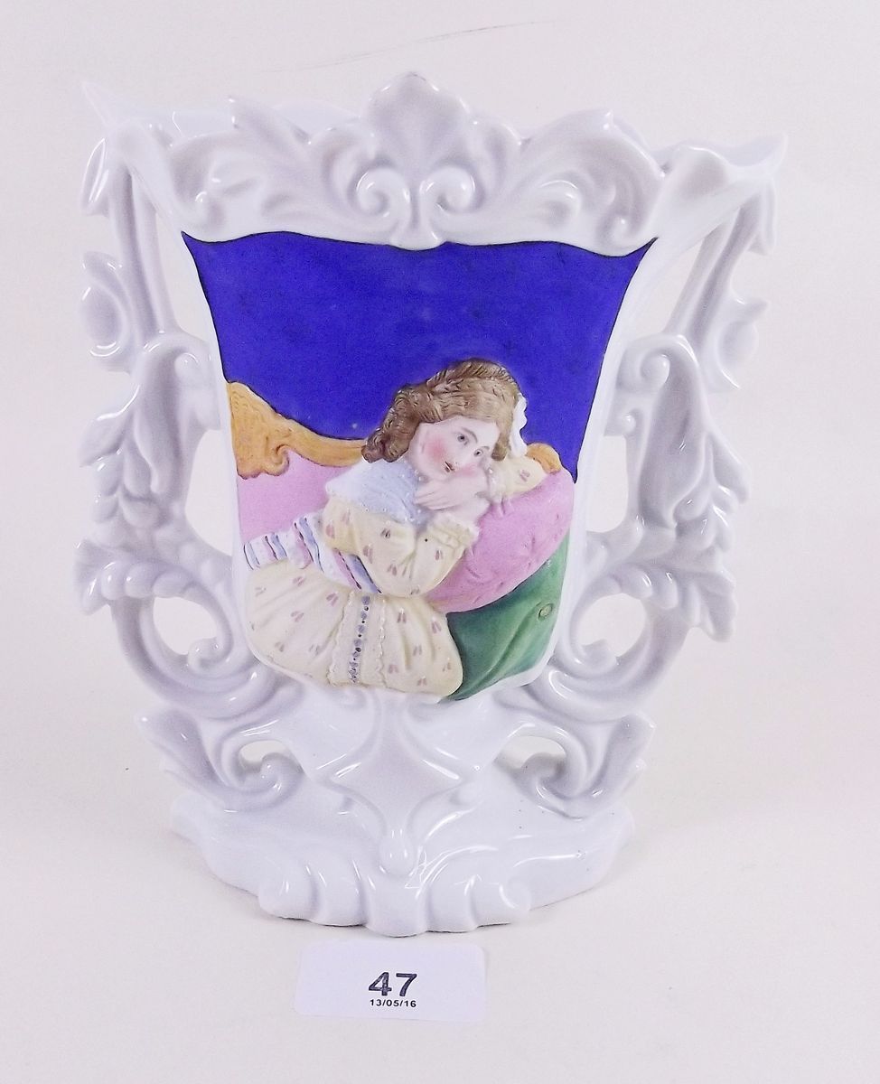 A 19th century porcelain vase with painted panel in relief depicting girl seated on settee