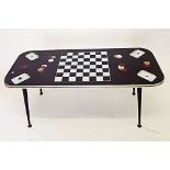 A 1960's coffee/games table with chessboard and cards printed to glass top