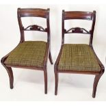 A pair of Regency bar back dining chairs on sabre supports