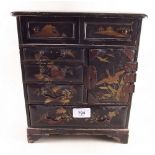 A 19th century Japanese gilt and black lacquer jewellery cabinet 29cm tall