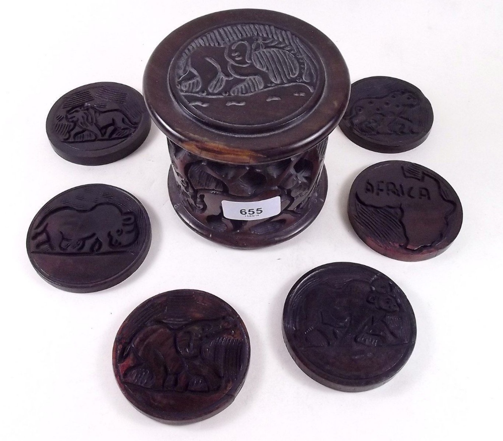 A set of African carved wood coasters in box