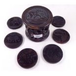 A set of African carved wood coasters in box