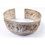 A 19th century Chinese silver bangle decorated figurative scenes