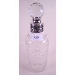 A lockable cut glass decanter with silver plated collar circa 1900 by James Dixon