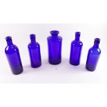 A collection of blue glass bottles