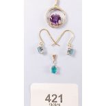 A 9 carat gold pendant set amethyst and a 9 carat gold pendant and pair of matching earrings set