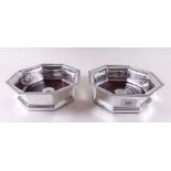 A large pair of octagonal silver wine coasters engraved with tank regiment insignia to centre -
