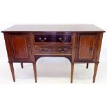 A Maple & Co. Edwardian mahogany crossbanded sideboard with two drawers flanked by cellarette