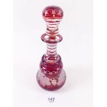 A Bohemian red glass scent bottle engraved vines