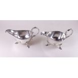 A pair of silver plated sauce boats engraved stag crest