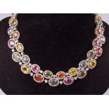 An 18 carat white gold necklace set double row of coloured sapphire and diamond clusters