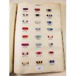 A collection of medal ribbons in albums including Germany, Britain, Russia, USA etc.