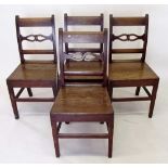 A set of four early 19th century oak slat back chairs with solid seats