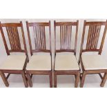 A set of four slat back dining chairs