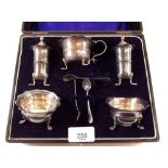 A silver plated five piece cruet set, boxed