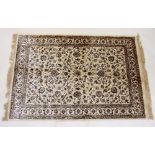 A Kashmir rug with all over floral design on an ivory ground - 1.7 x 1.2m