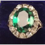 A vintage 9ct gold faux diamond and emerald cluster ring