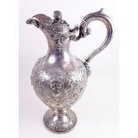 A Victorian fine silver wine ewer with embossed and applied decoration by Mackay and Chisholm -