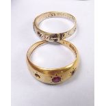 An 18 carat gold gypsy ring (stone missing) and a Victorian 9 carat gold buckle ring (total weight