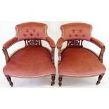 A pair of Victorian tub chairs with marquetry decoration to backs