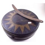 A vintage ethnic folk circular drum painted star and dragon design (faded) and a seed pod rattle