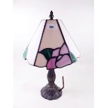A bronze finish table lamp and glass shade