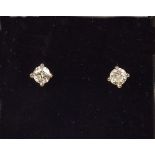 A pair of 18 carat gold diamond earrings (approx total 1/2 carat)